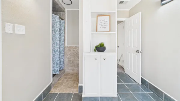 a building outdoor space with patio furniture and potted plants