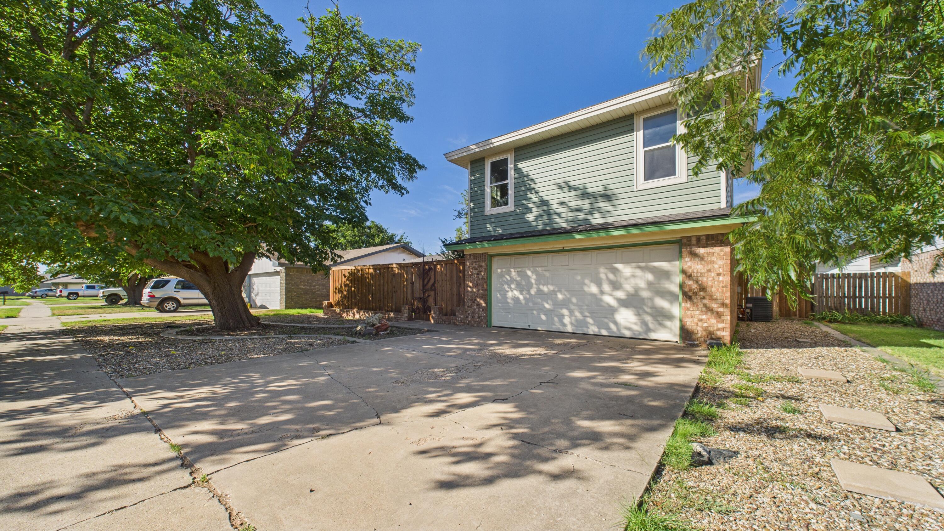 5719 2nd Street Lubbock, TX 79416 - Photo 5 of 61 a view of a house with a yard