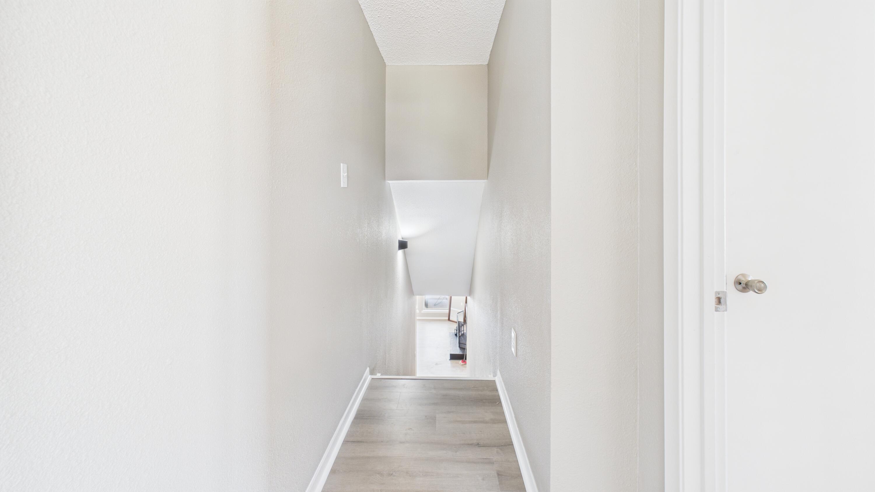 5719 2nd Street Lubbock, TX 79416 - Photo 56 of 61 a view of a hallway with wooden floor