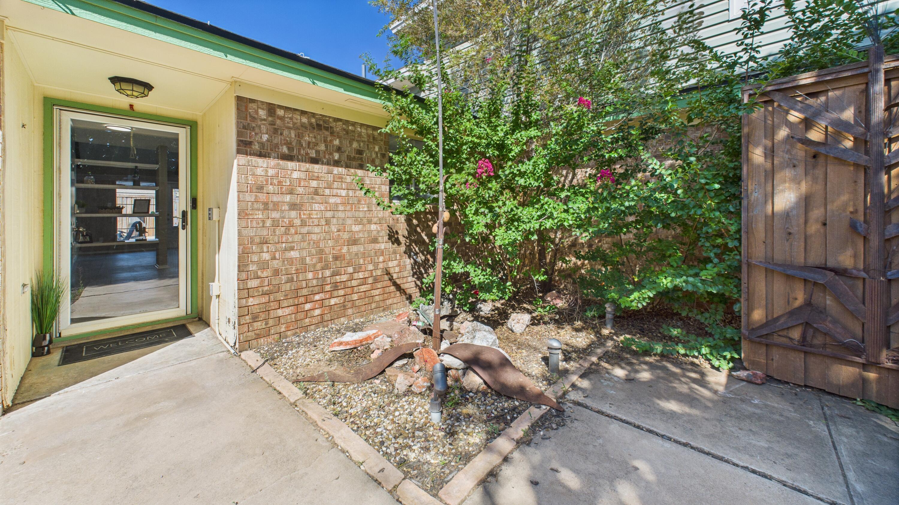 5719 2nd Street Lubbock, TX 79416 - Photo 10 of 61 a backyard of a house with a tree