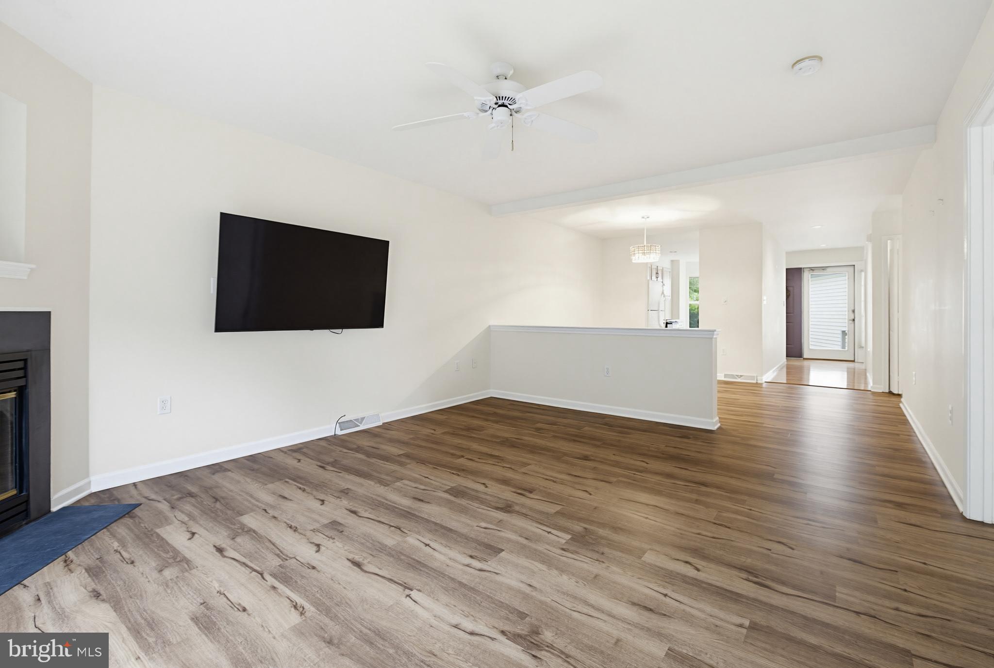 1037 Kent Garden Lititz, PA 17543 - Photo 17 of 31 a view of a livingroom with wooden floor and a flat screen tv