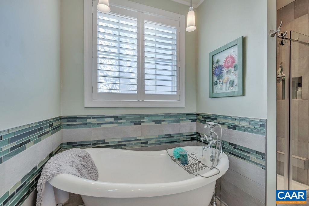 35 Oak Grove Road Palmyra, VA 22963 - Photo 14 of 42 a bath tub sitting in a bathroom next to a window