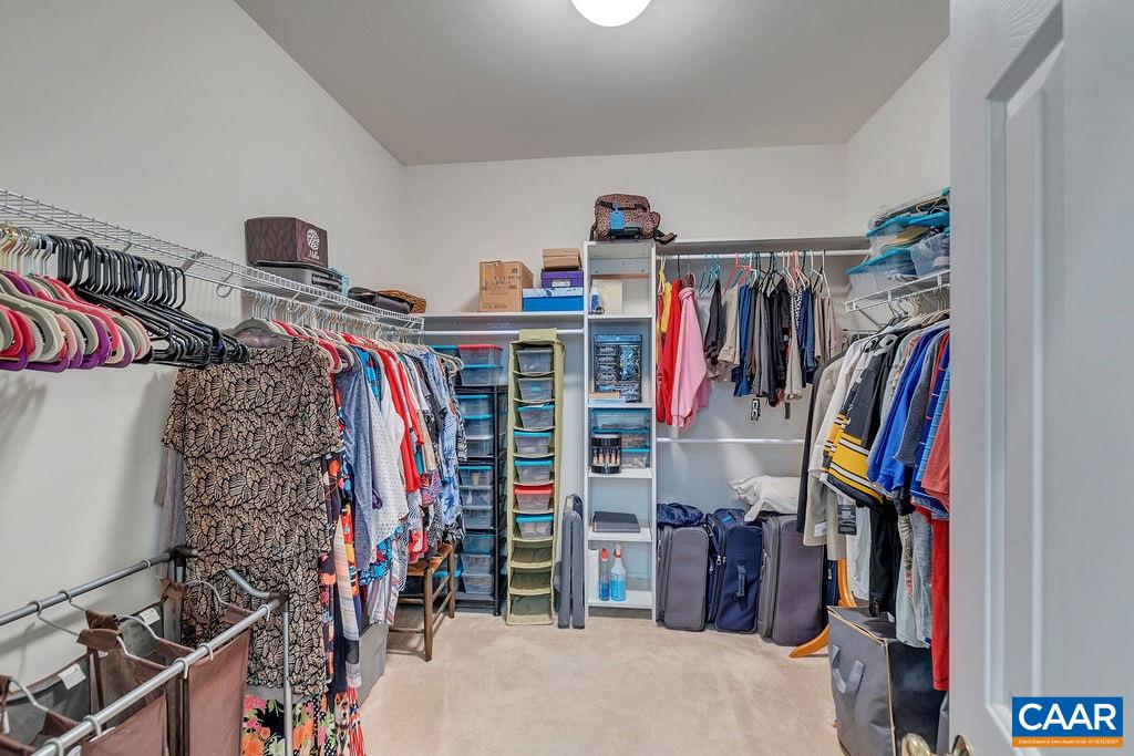 35 Oak Grove Road Palmyra, VA 22963 - Photo 17 of 42 a view of walk in closet with clothes