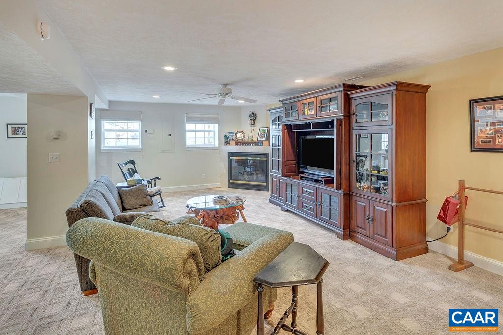 35 Oak Grove Road Palmyra, VA 22963 - Photo 24 of 42 a living room with furniture and a flat screen tv