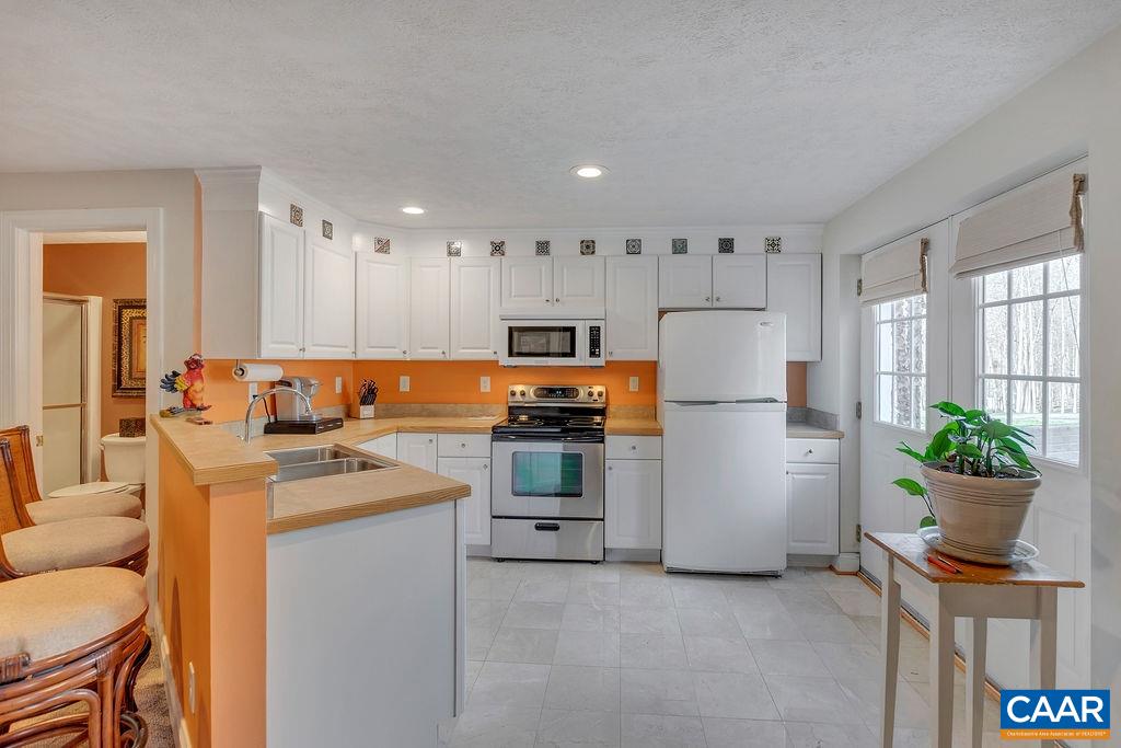 35 Oak Grove Road Palmyra, VA 22963 - Photo 25 of 42 a kitchen with refrigerator and cabinets