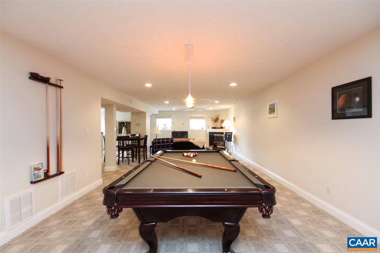 35 Oak Grove Road Palmyra, VA 22963 - Photo 29 of 42 a room with a table chairs and a projector screen