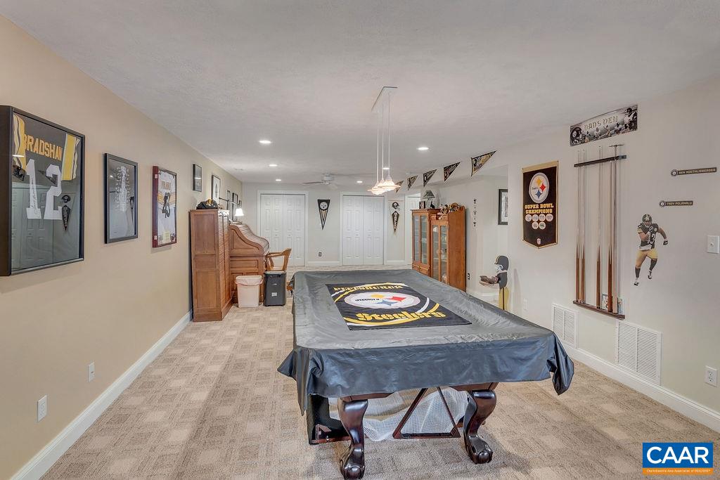 35 Oak Grove Road Palmyra, VA 22963 - Photo 31 of 42 a living room with furniture and a table