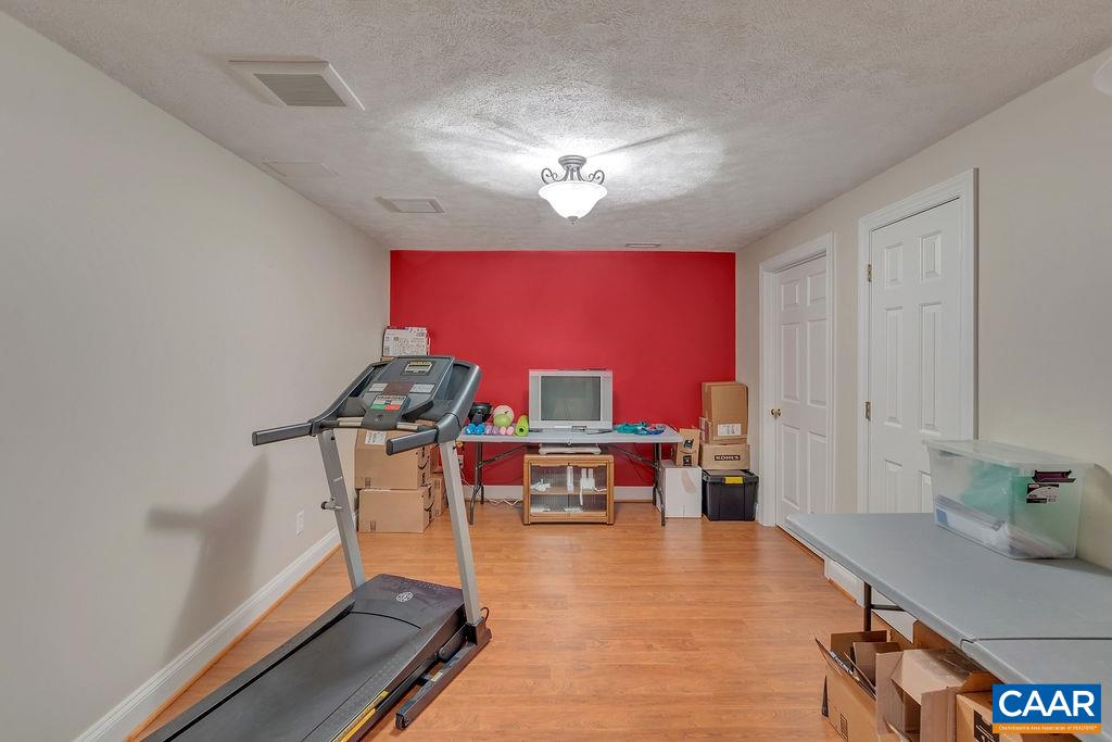 35 Oak Grove Road Palmyra, VA 22963 - Photo 33 of 42 a view of a room with furniture and wooden floor