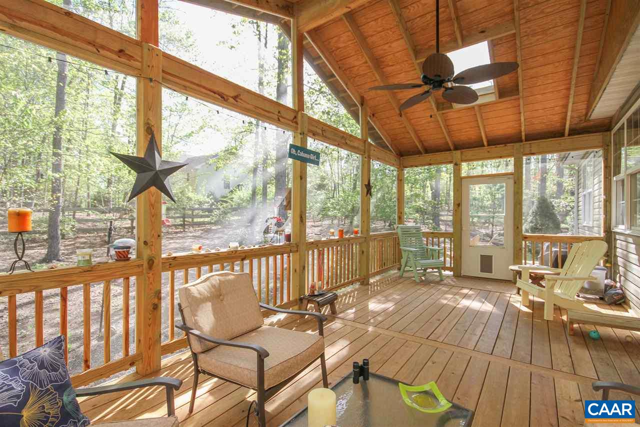 35 Oak Grove Road Palmyra, VA 22963 - Photo 38 of 42 a balcony with furniture and large windows
