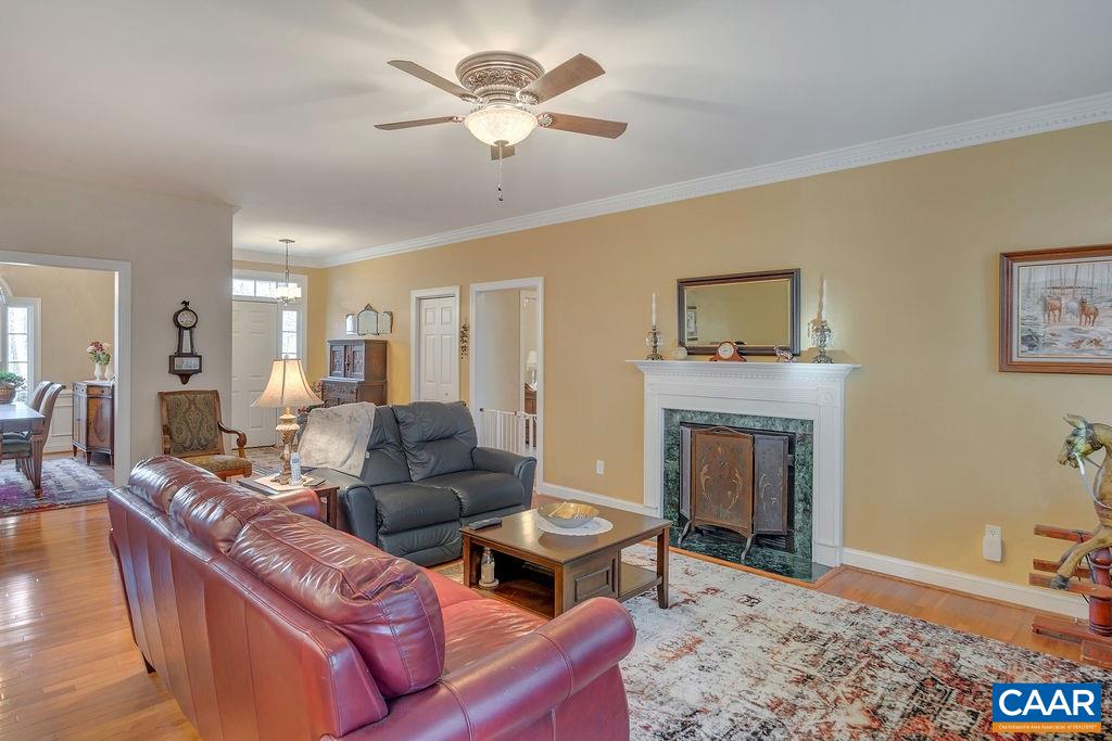 35 Oak Grove Road Palmyra, VA 22963 - Photo 6 of 42 a living room with furniture a fireplace