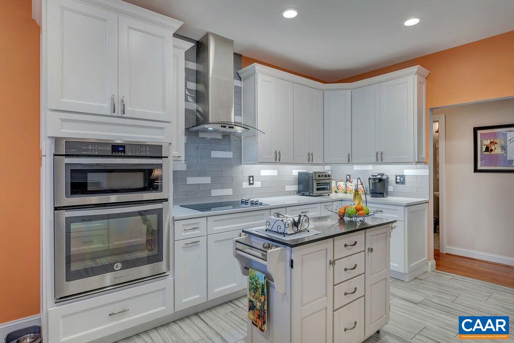 35 Oak Grove Road Palmyra, VA 22963 - Photo 7 of 42 a kitchen with granite countertop white cabinets and appliances