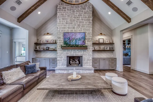 a living room with furniture and a fireplace