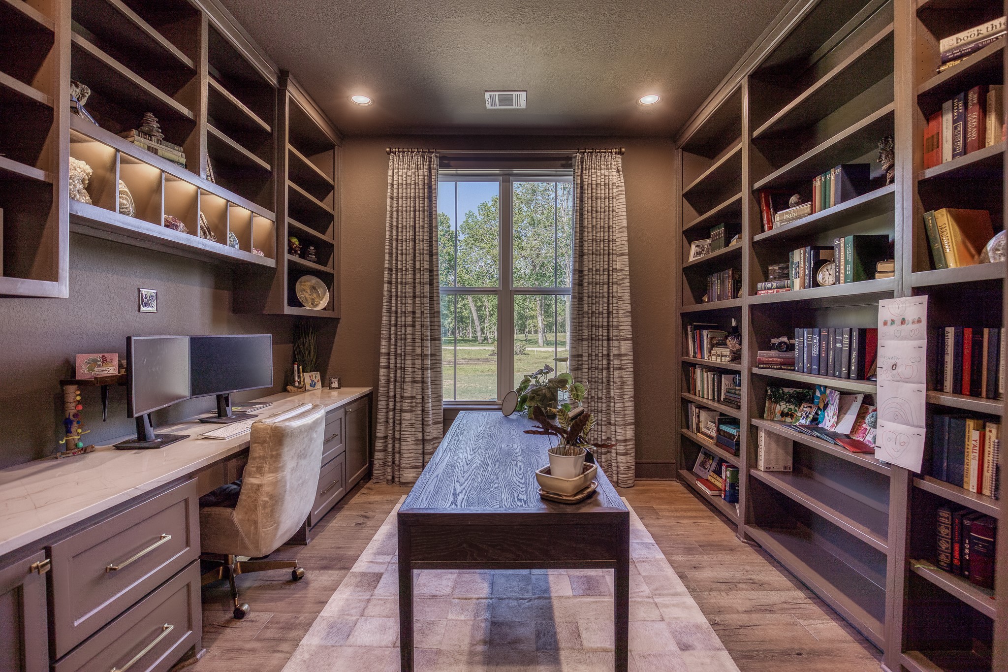 40051 Mesquite Hempstead, TX 77445 - Photo 14 of 29 a view of a workspace with furniture and a book shelf
