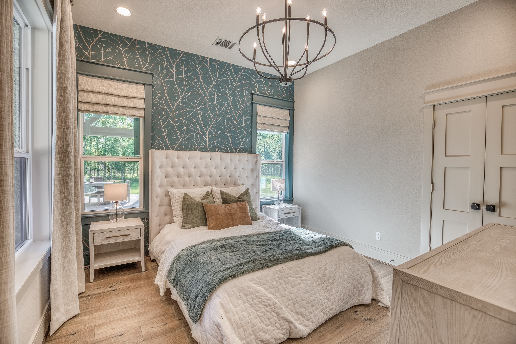 40051 Mesquite Hempstead, TX 77445 - Photo 19 of 29 a bedroom with a bed and a chandelier