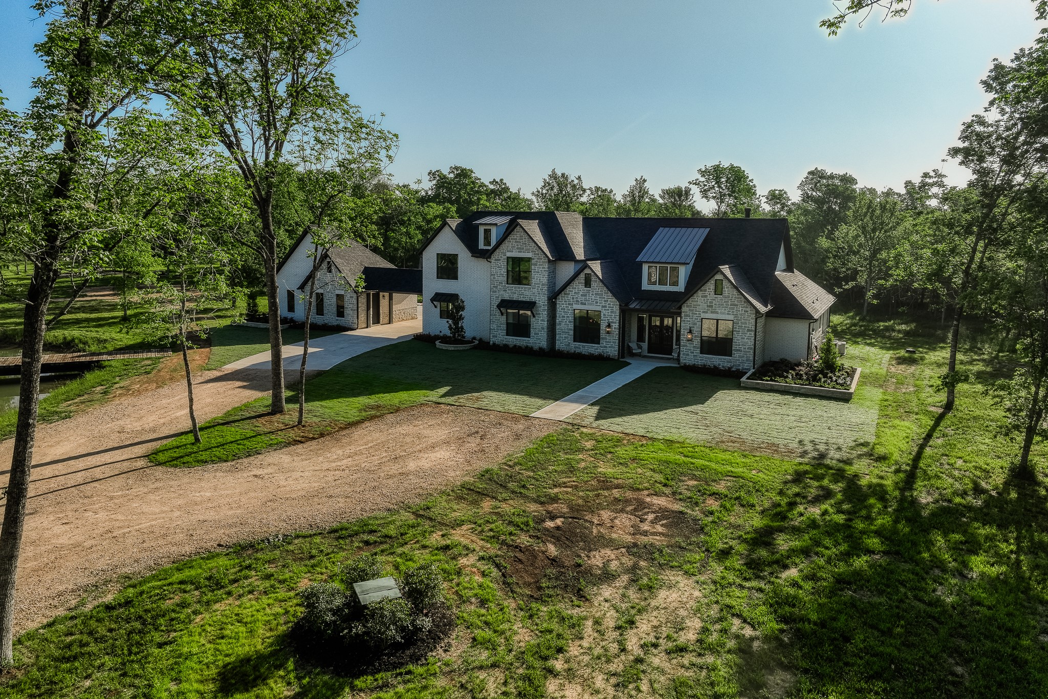 40051 Mesquite Hempstead, TX 77445 - Photo 3 of 29 a front view of a house with garden