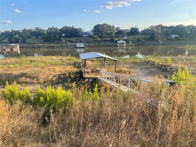 a view of a lake in middle of forest