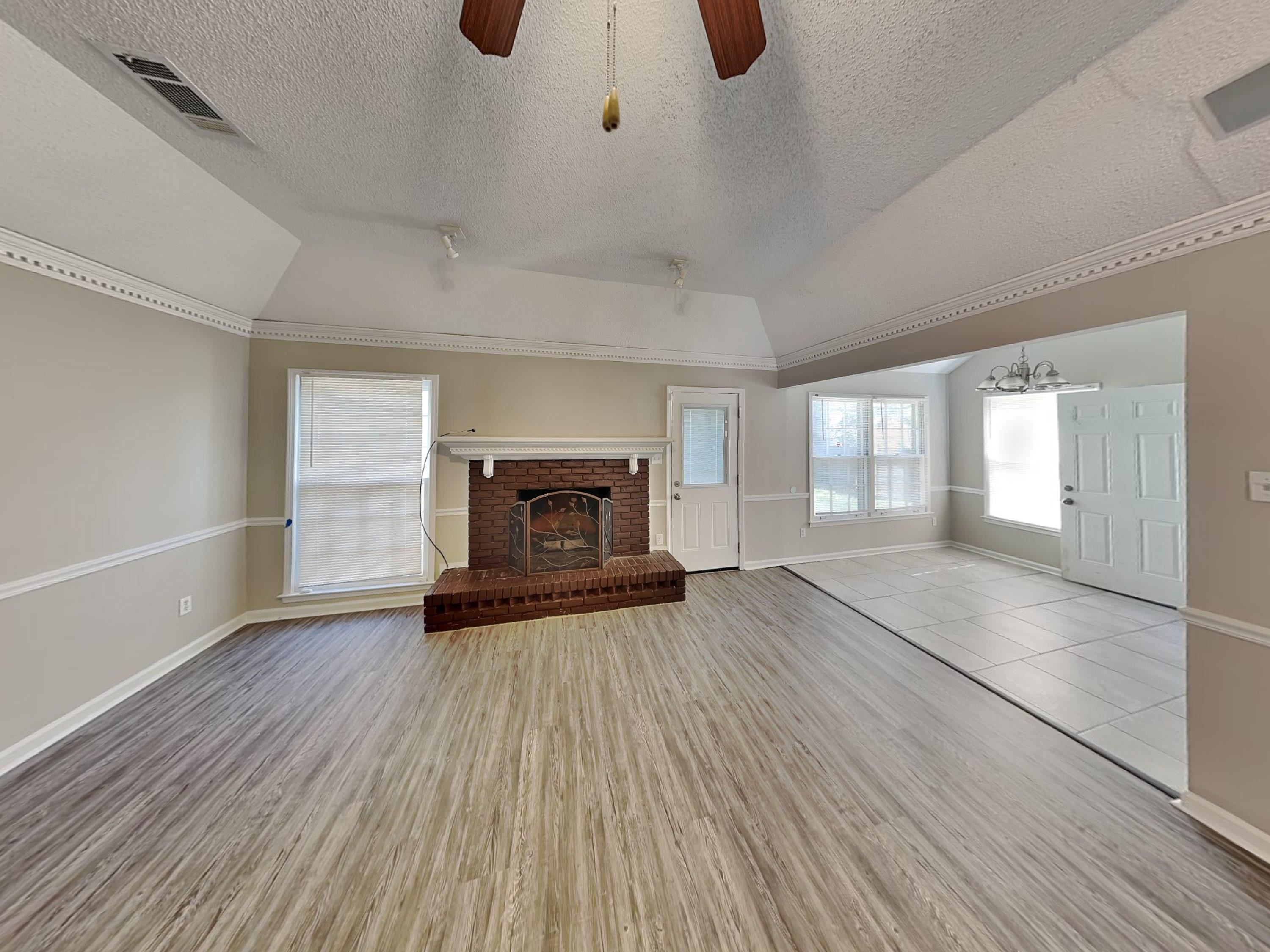 7041 Cutter Mill Road Memphis, TN 38141 - Photo 2 of 18 a view of empty room with fireplace and wooden floor