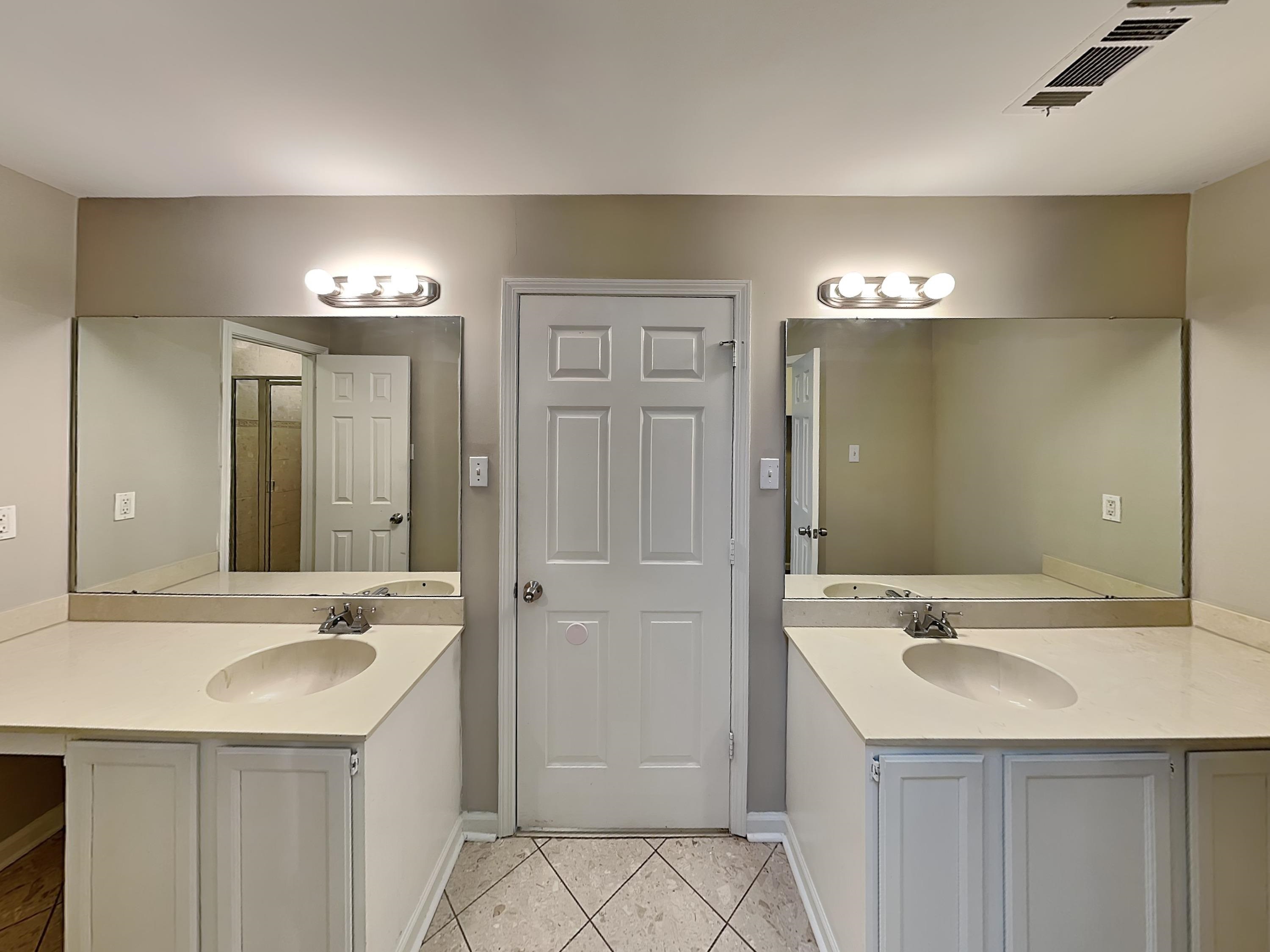 7041 Cutter Mill Road Memphis, TN 38141 - Photo 8 of 18 a bathroom with a sink and a mirror