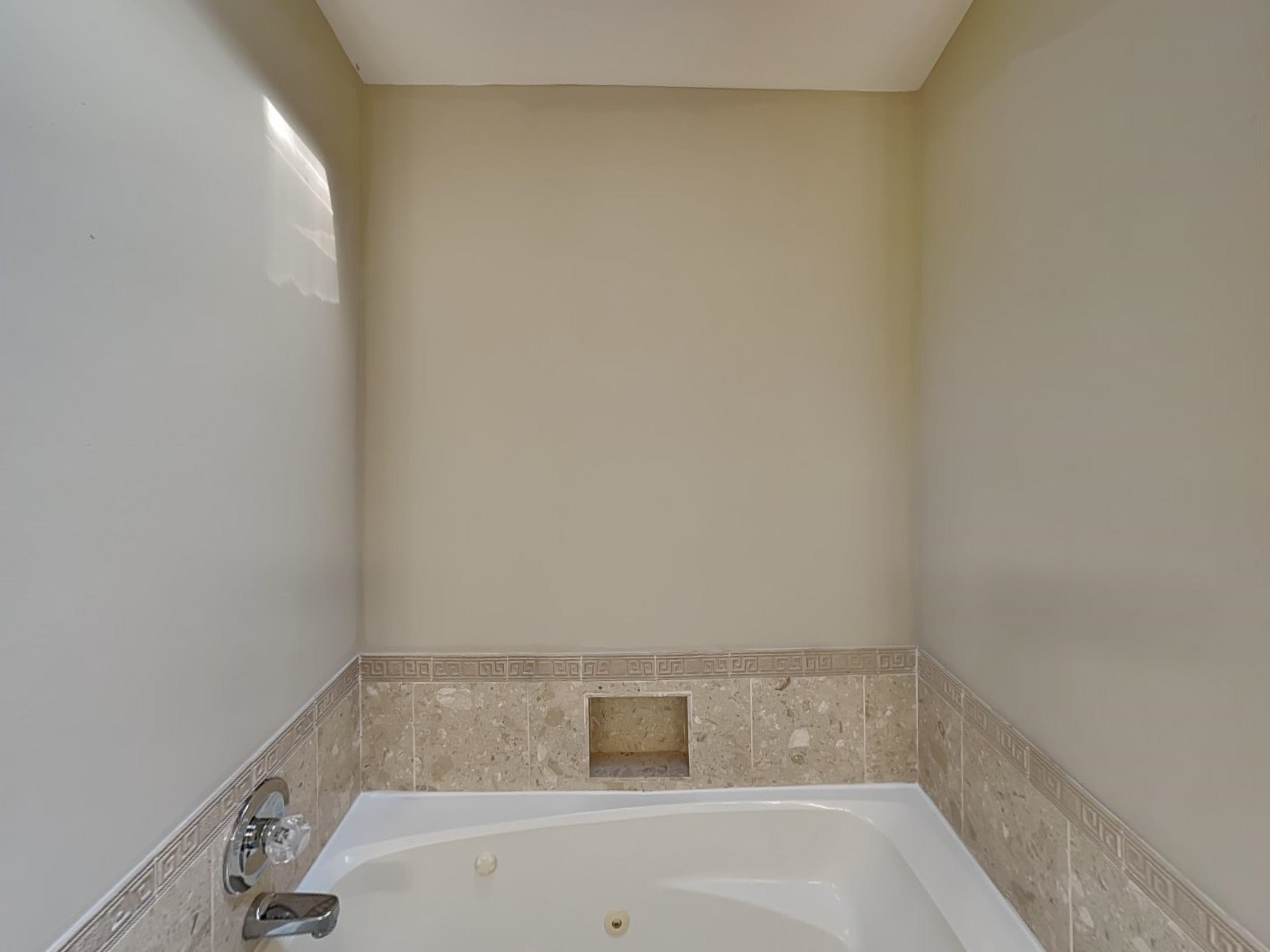 7041 Cutter Mill Road Memphis, TN 38141 - Photo 9 of 18 a bathroom with a bathtub
