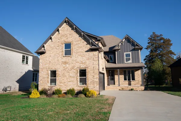 a front view of a house with a garage