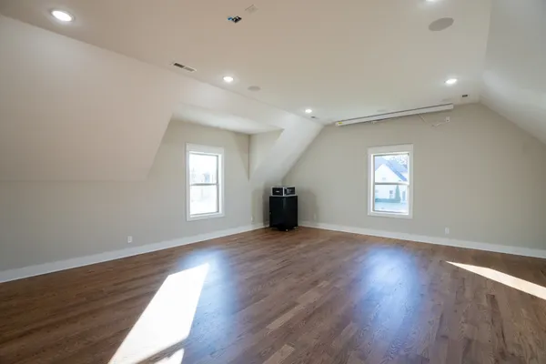a bathroom with a granite countertop toilet a sink and a mirror