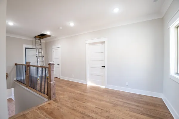 a living room with a bed furniture and a window