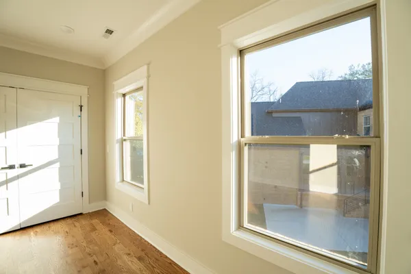 a bedroom with a bed and window