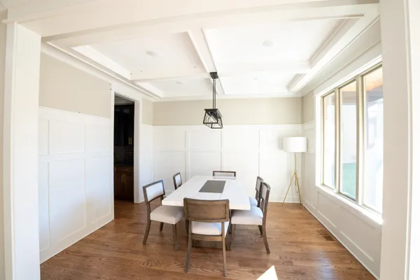 a dining room with furniture and window