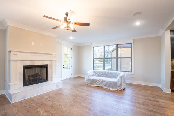 a living room with furniture fireplace and flat screen tv