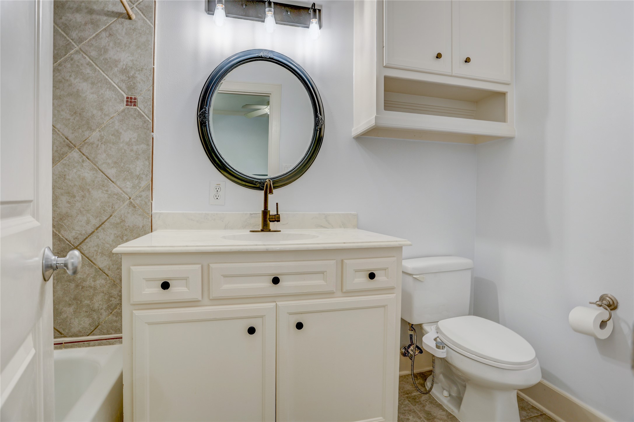 4262 Childress Street, Unit B Houston, TX 77005 - Photo 20 of 22 a bathroom with a toilet sink and mirror