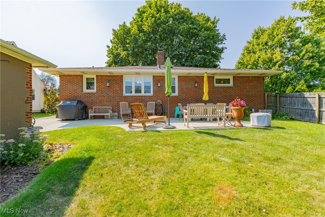431 Stanley Road Akron, OH 44312 - Photo 25 of 29 Back of property with a patio area and a lawn