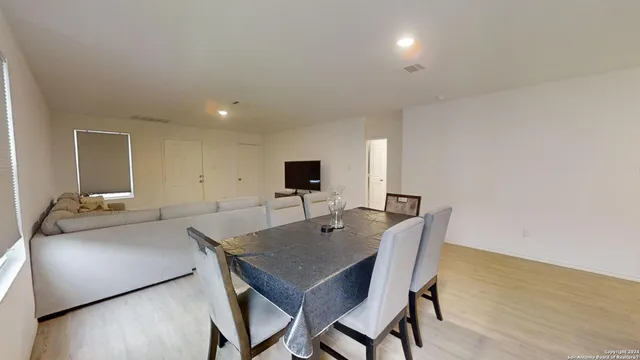 a view of a dining room with furniture