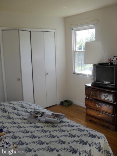 14309 Ansted Road Silver Spring, MD 20905 - Photo 12 of 17 a bedroom with a bed and a window