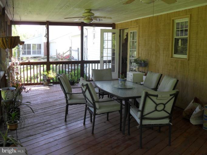 14309 Ansted Road Silver Spring, MD 20905 - Photo 15 of 17 a view of a dining room with furniture window and wooden floor