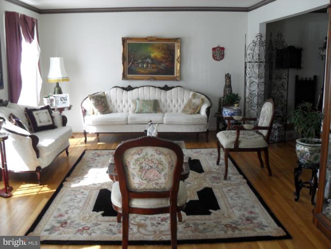 14309 Ansted Road Silver Spring, MD 20905 - Photo 5 of 17 a living room with furniture and a couch