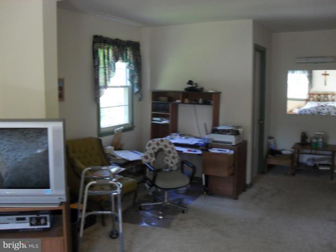 14309 Ansted Road Silver Spring, MD 20905 - Photo 10 of 17 a living room with furniture and a window