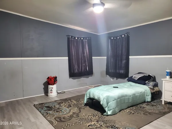 a bedroom with a bed and a window