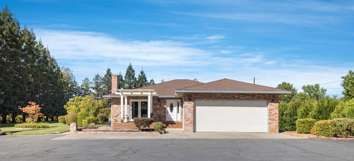 20201 Dustin Road Acampo, CA 95220 - Photo 1 of 16 front view of a house with a yard
