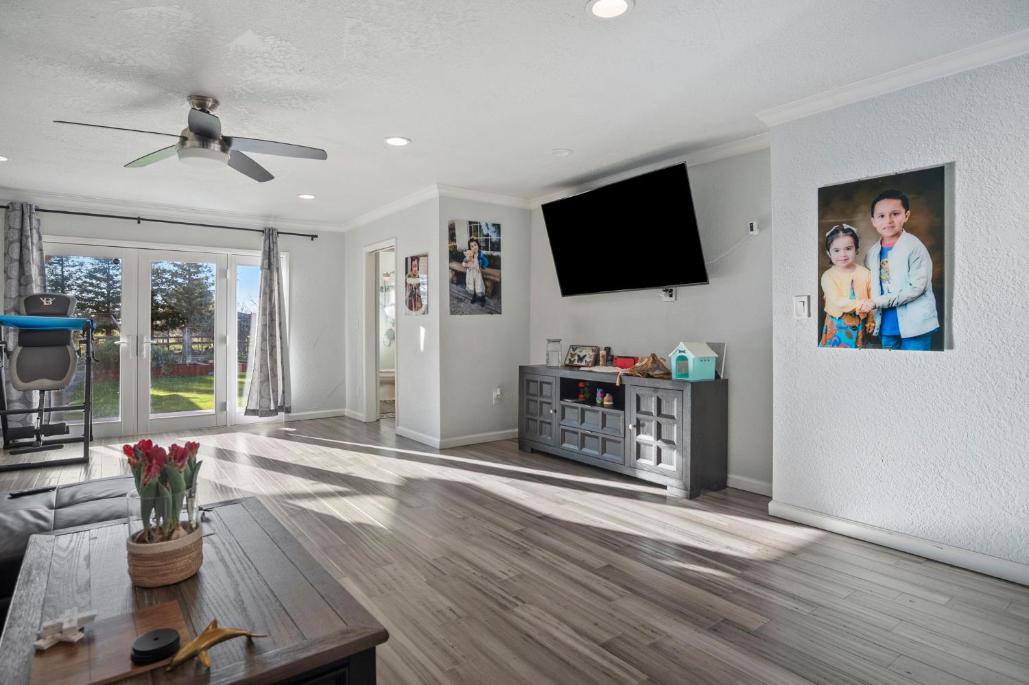 20201 Dustin Road Acampo, CA 95220 - Photo 7 of 16 a living room with furniture and a flat screen tv