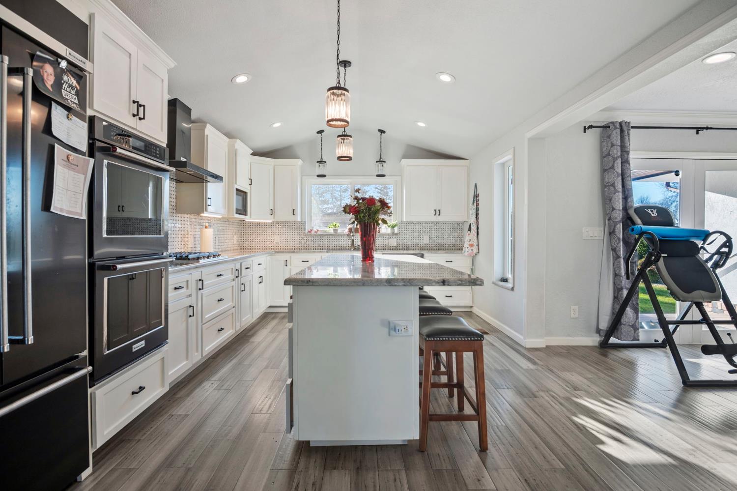 20201 Dustin Road Acampo, CA 95220 - Photo 9 of 16 a kitchen with a sink appliances and cabinets
