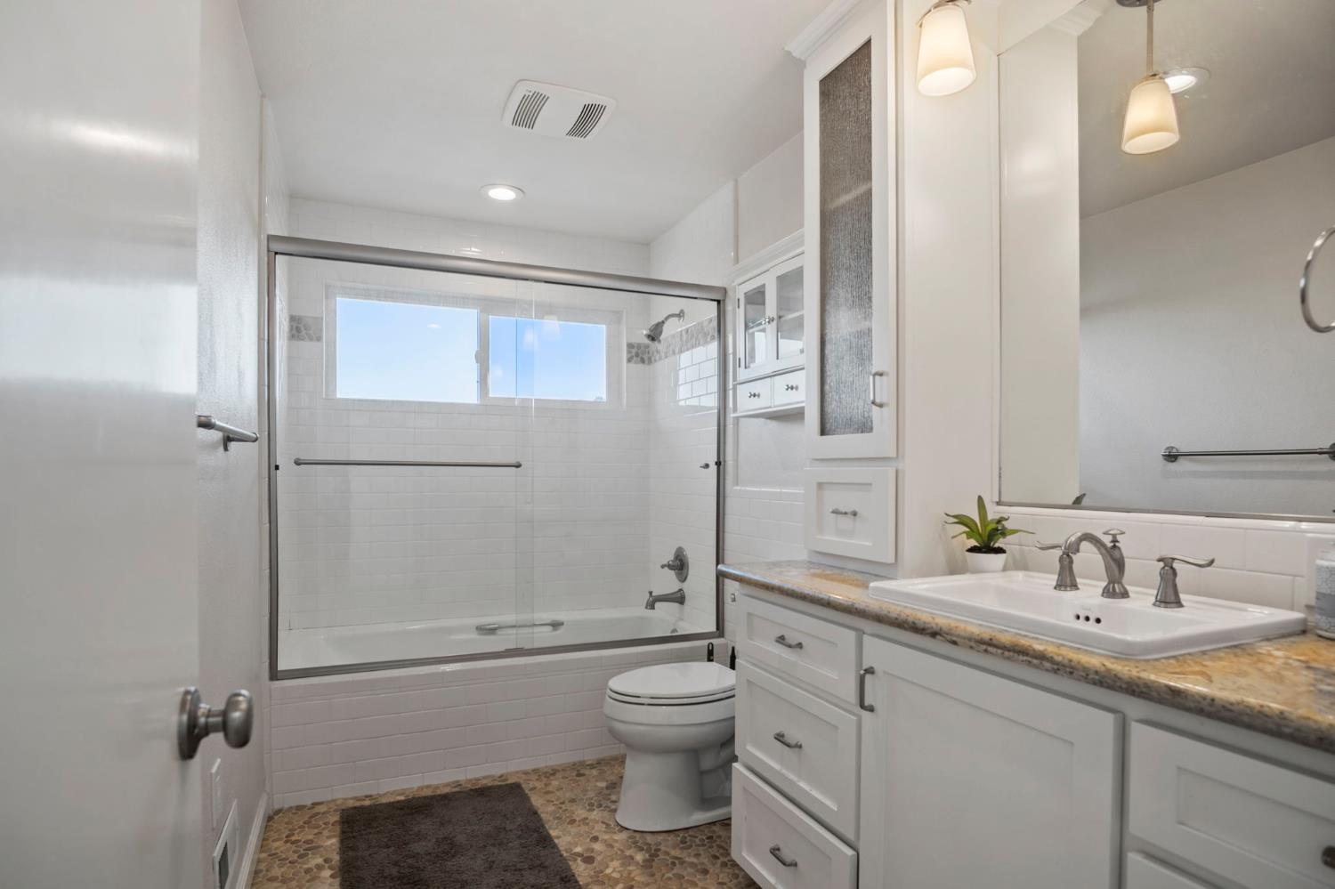 20201 Dustin Road Acampo, CA 95220 - Photo 10 of 16 a bathroom with a granite countertop sink toilet and shower