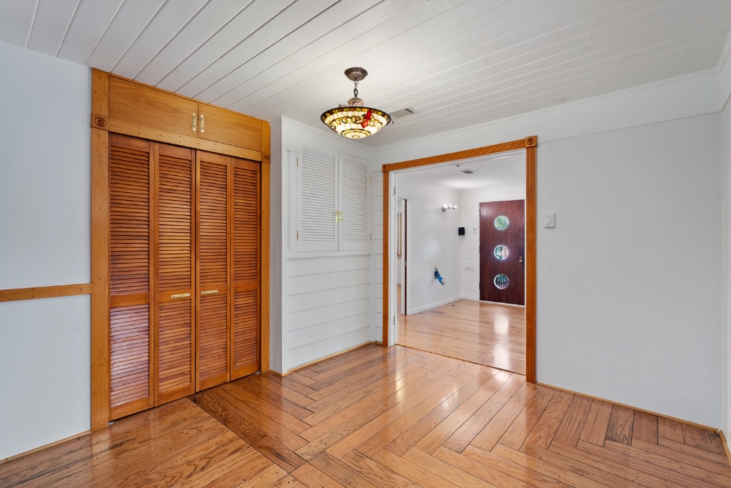 1212 Bentwood Road Austin, TX 78722 - Photo 13 of 32 a view of an entryway with wooden floor