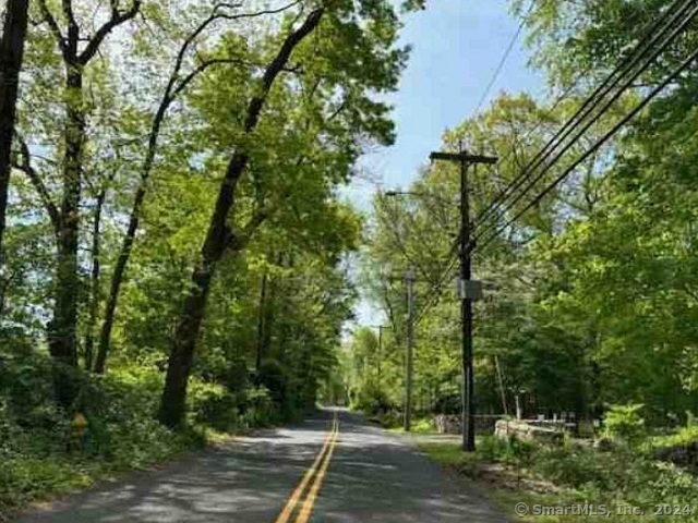 2425 Merwins Lane Fairfield, CT 06824 - Photo 2 of 2 a view of a yard with plants and trees