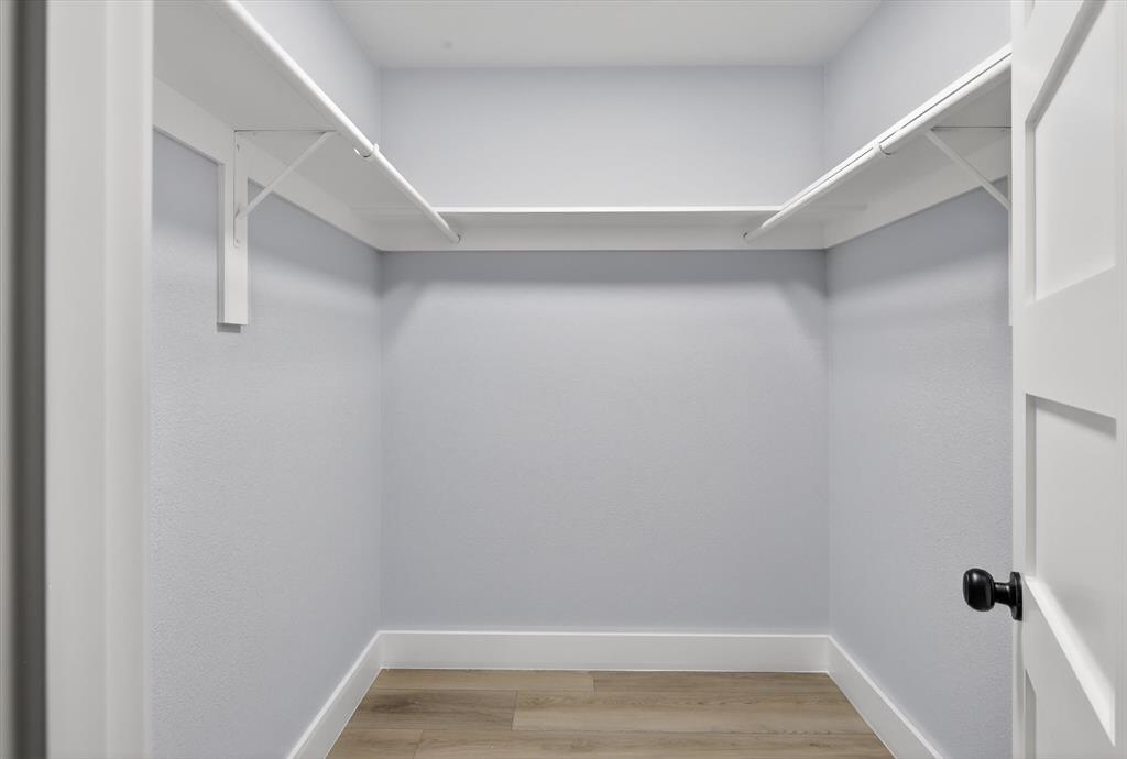 2005 Chestnut Road Carrollton, TX 75007 - Photo 28 of 35 a view of room with racks on the wall
