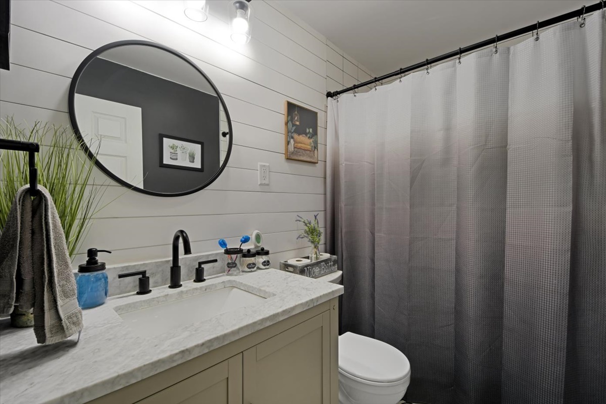 215 North 3rd Street Fisher, IL 61843 - Photo 7 of 17 a bathroom with a sink and a mirror