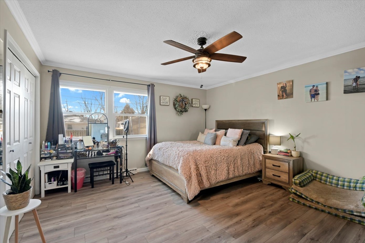 215 North 3rd Street Fisher, IL 61843 - Photo 8 of 17 a bedroom with a bed and a large window