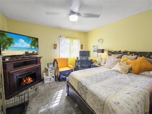 a bedroom with a bed and a fireplace