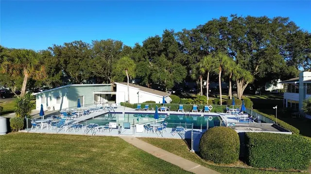 a view of a swimming pool with a patio