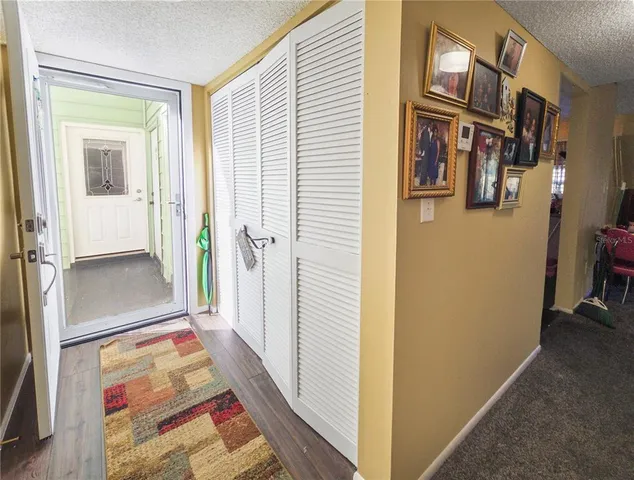 a view of hallway with livingroom