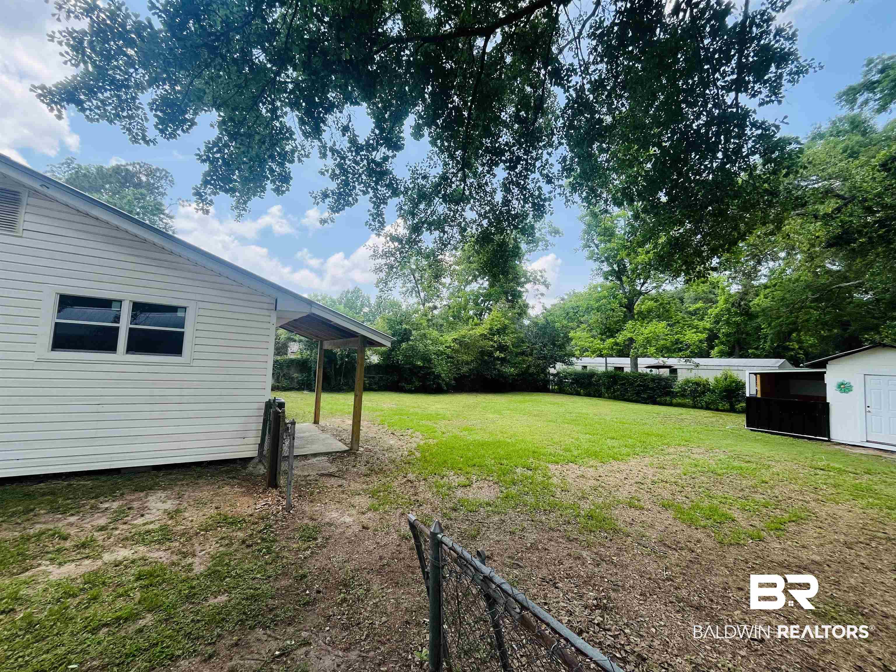 18855 Crocker Lane Foley, AL 36535 - Photo 23 of 25 View of yard with a storage shed and an outdoor structure